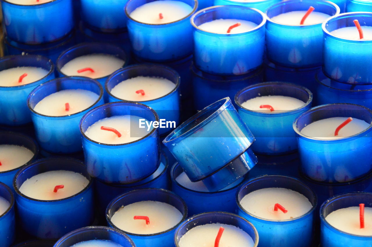 FULL FRAME SHOT OF BLUE CANDLES