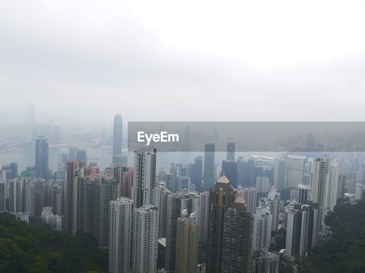 AERIAL VIEW OF CITY BUILDINGS AGAINST SKY