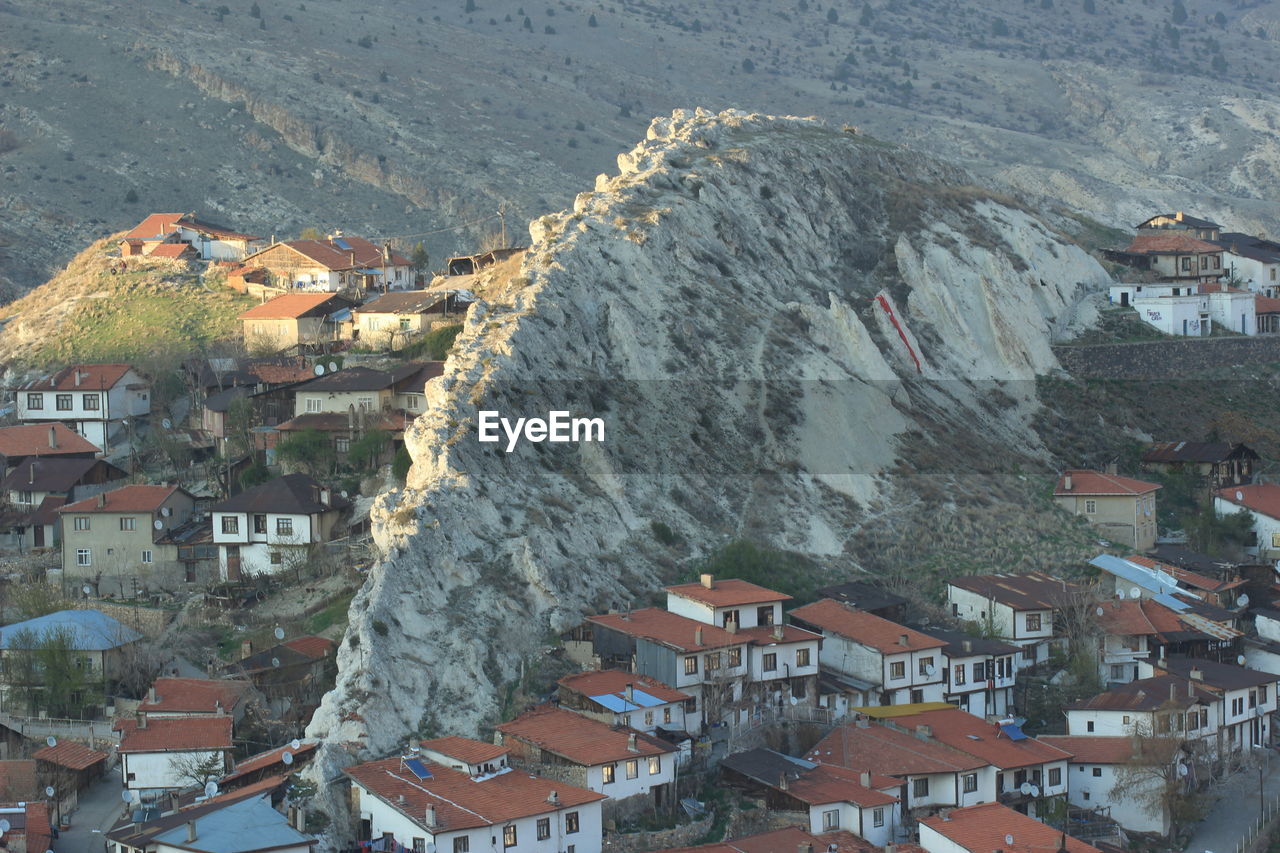 High angle view of houses and cityscape against sky