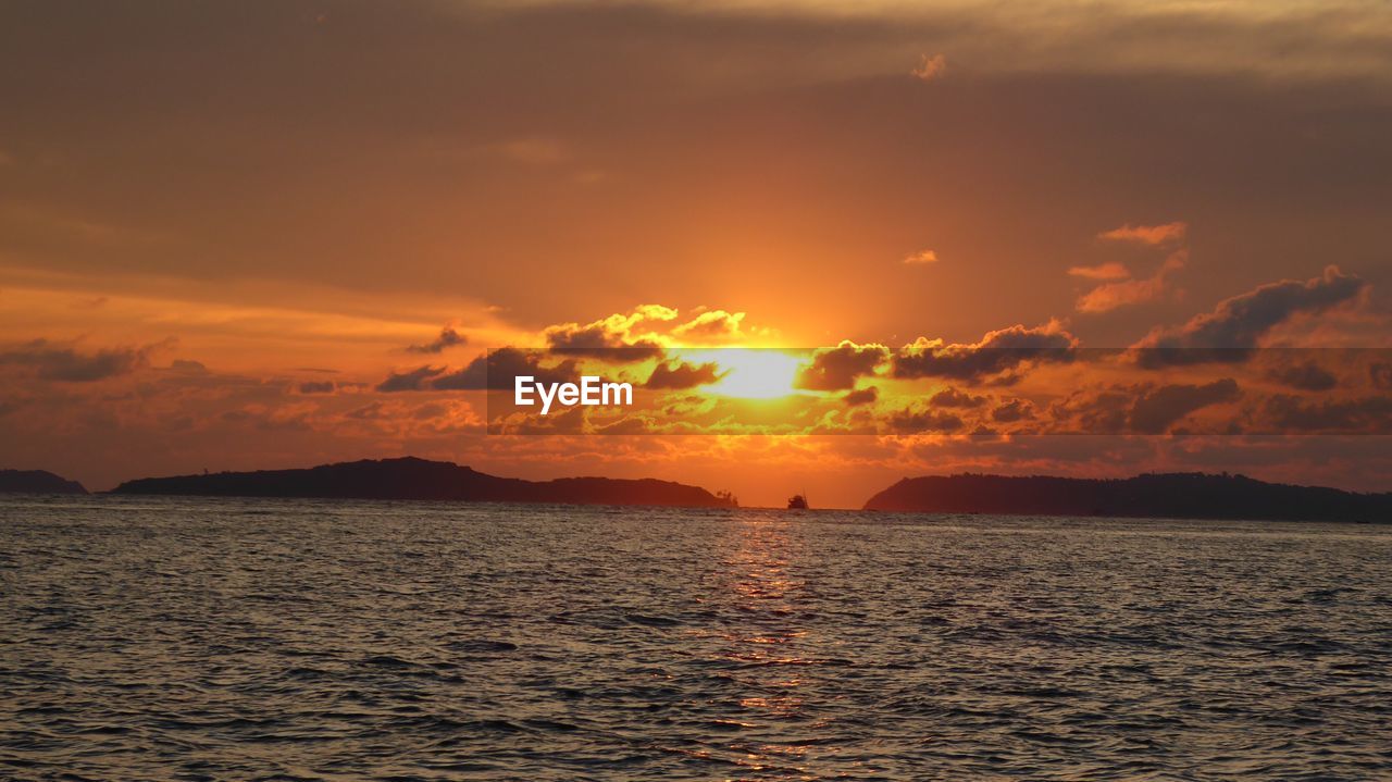 Scenic view of sea against sky during sunset