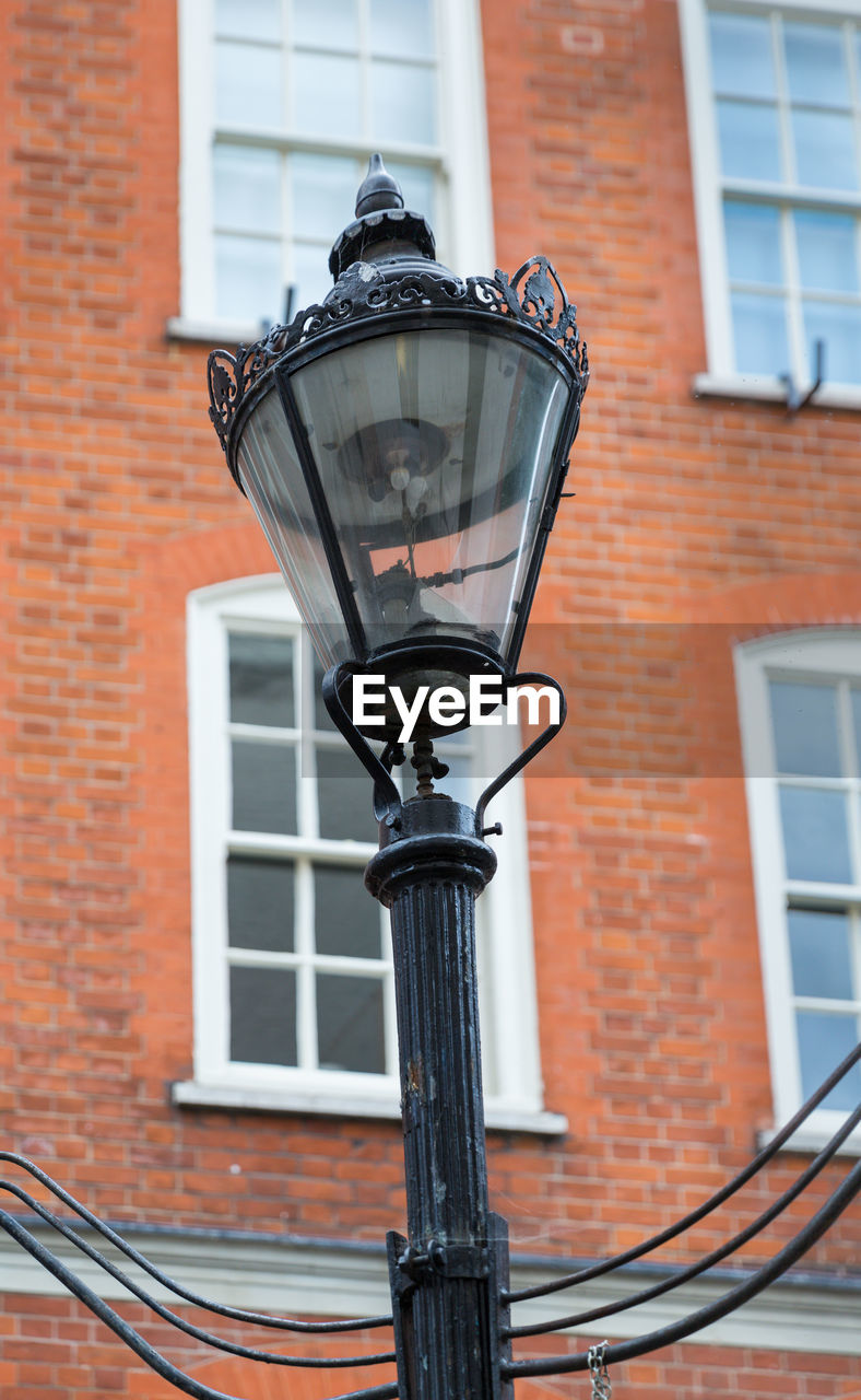 LOW ANGLE VIEW OF STREET LIGHT AND BUILDING