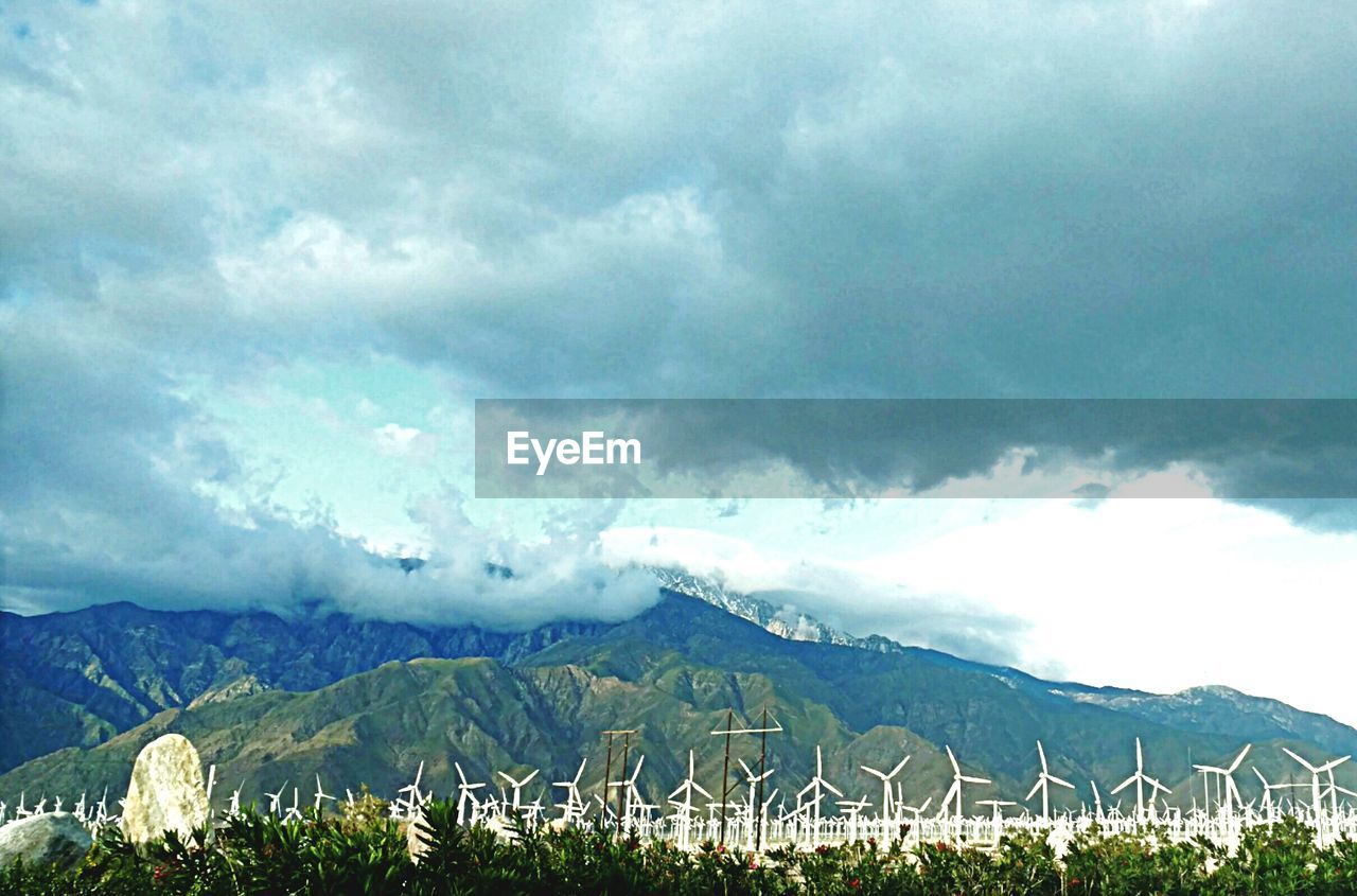 SCENIC VIEW OF DRAMATIC LANDSCAPE AGAINST STORM CLOUDS