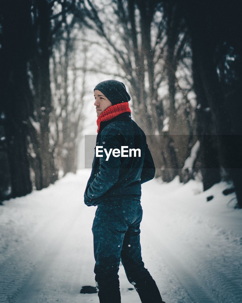 Woman standing in snow