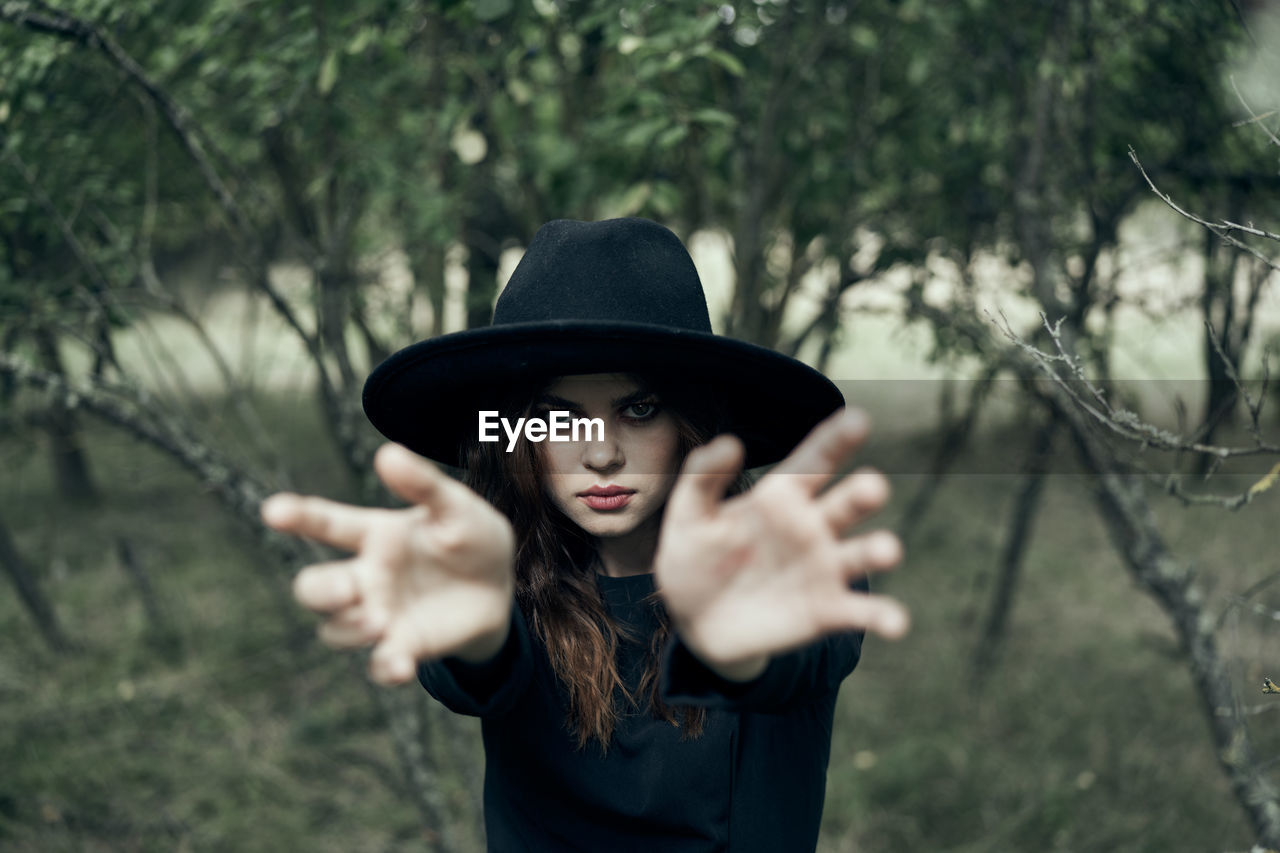 young woman wearing hat