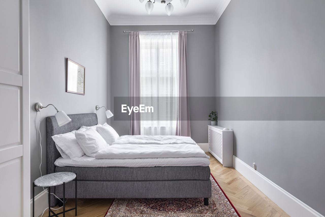 Modern minimal bedroom, grey palette in budapest, hungary.