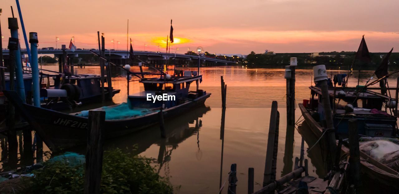 SAILBOATS IN MARINA AT SUNSET