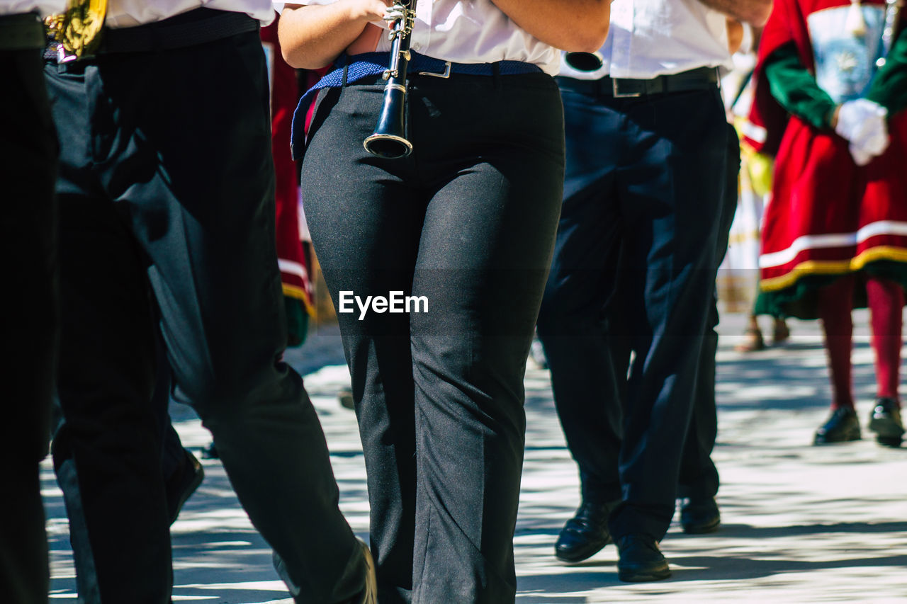 PEOPLE STANDING ON STREET