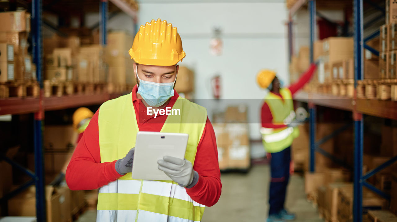 Factory worker using tablet