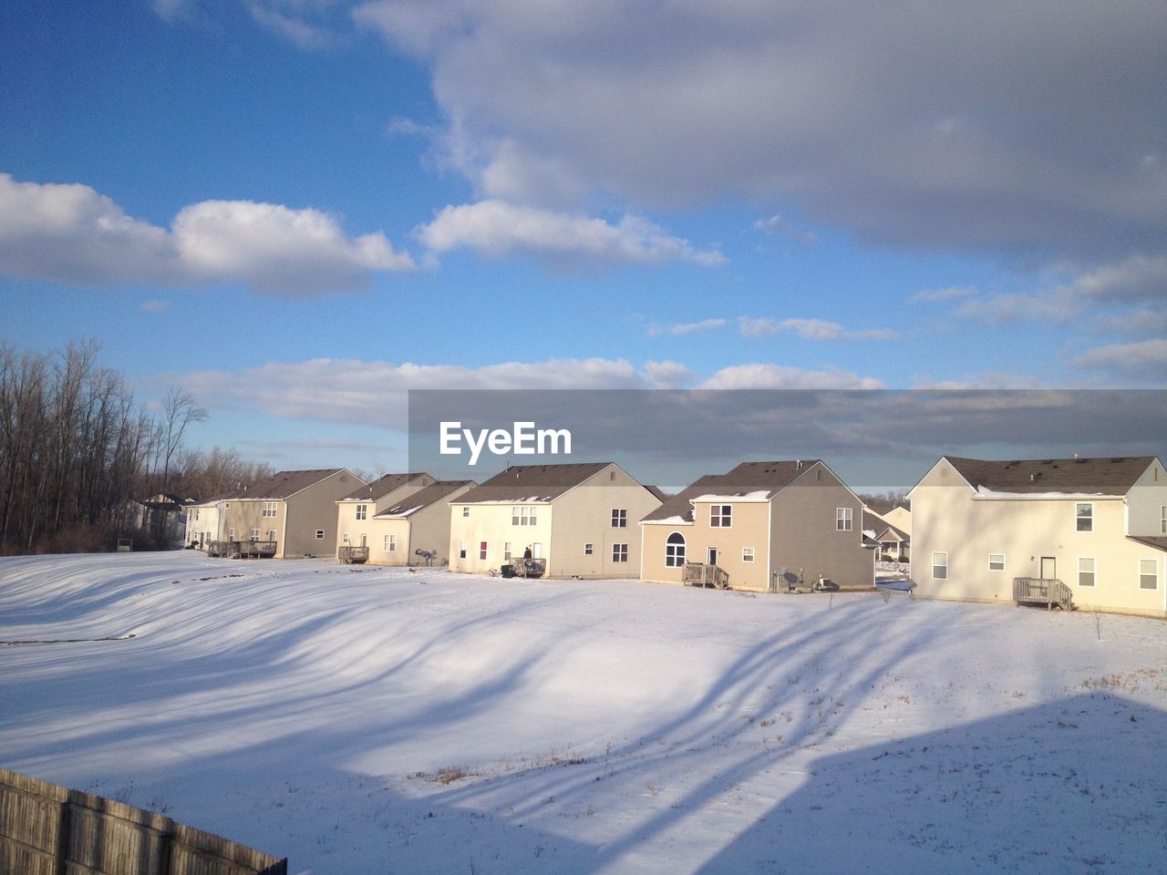 Houses on snow covered landscape