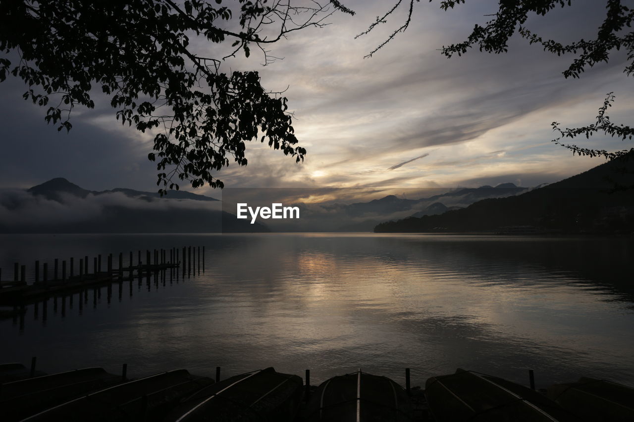 Scenic view of lake against sky during sunset