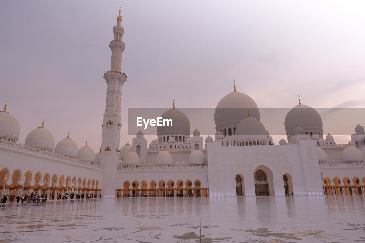 Historic mosque against sky during sunset