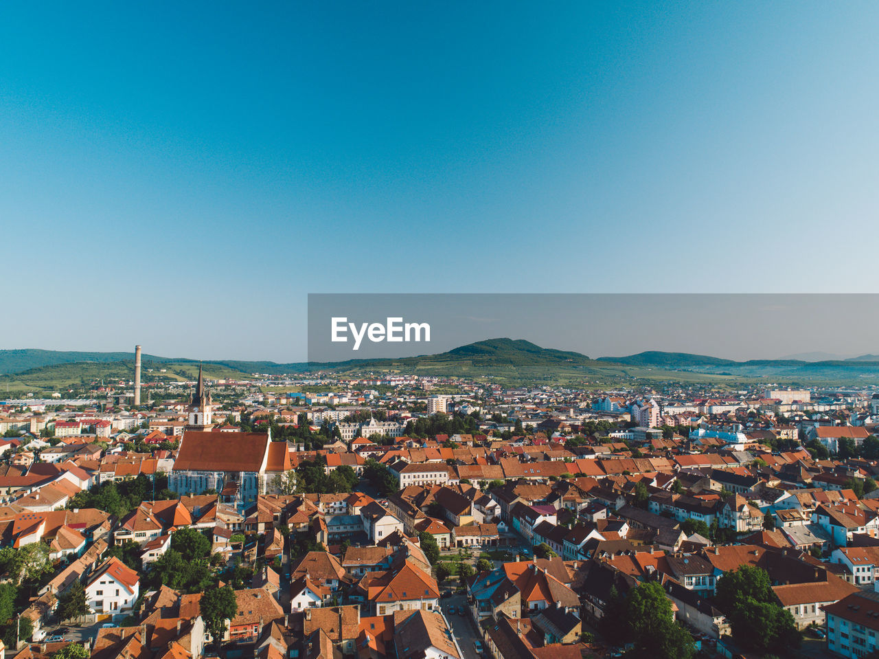 High angle view of townscape against blue sky