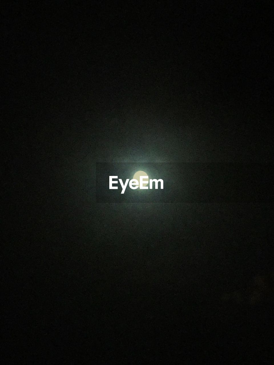 LOW ANGLE VIEW OF ILLUMINATED MOON AGAINST CLEAR SKY