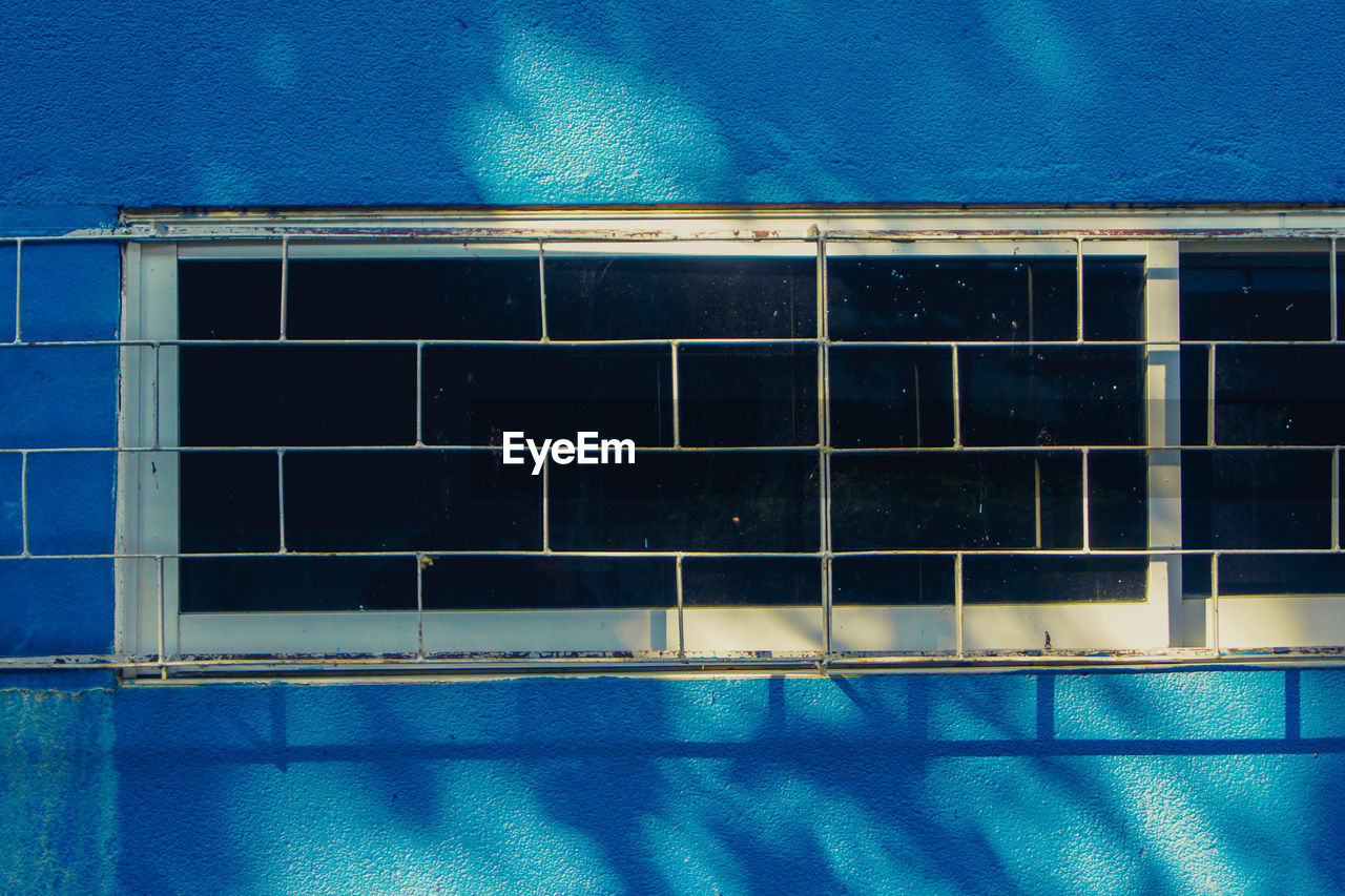 SWIMMING POOL BY BUILDING AGAINST SKY