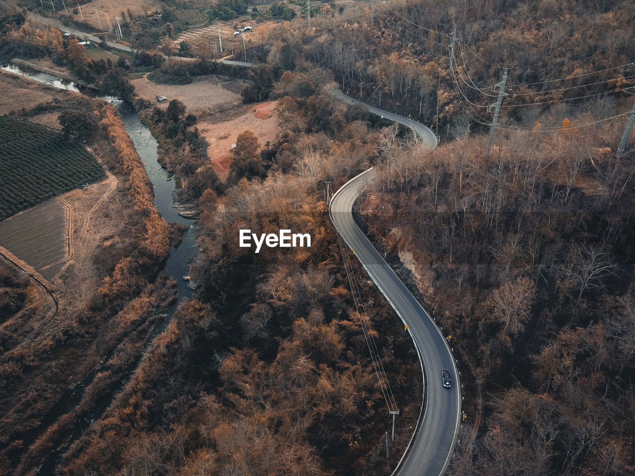 High angle view of tire tracks on road