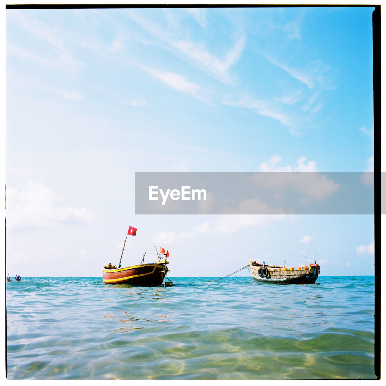 BOAT ON SEA AGAINST SKY