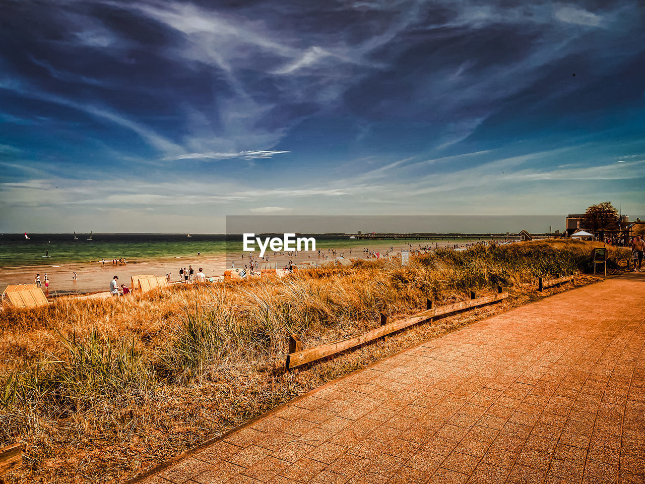 SCENIC VIEW OF SEA SHORE AGAINST SKY