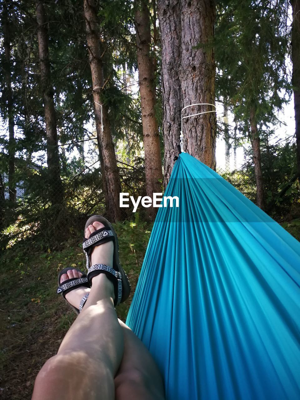 LOW SECTION OF WOMAN SITTING AT TENT