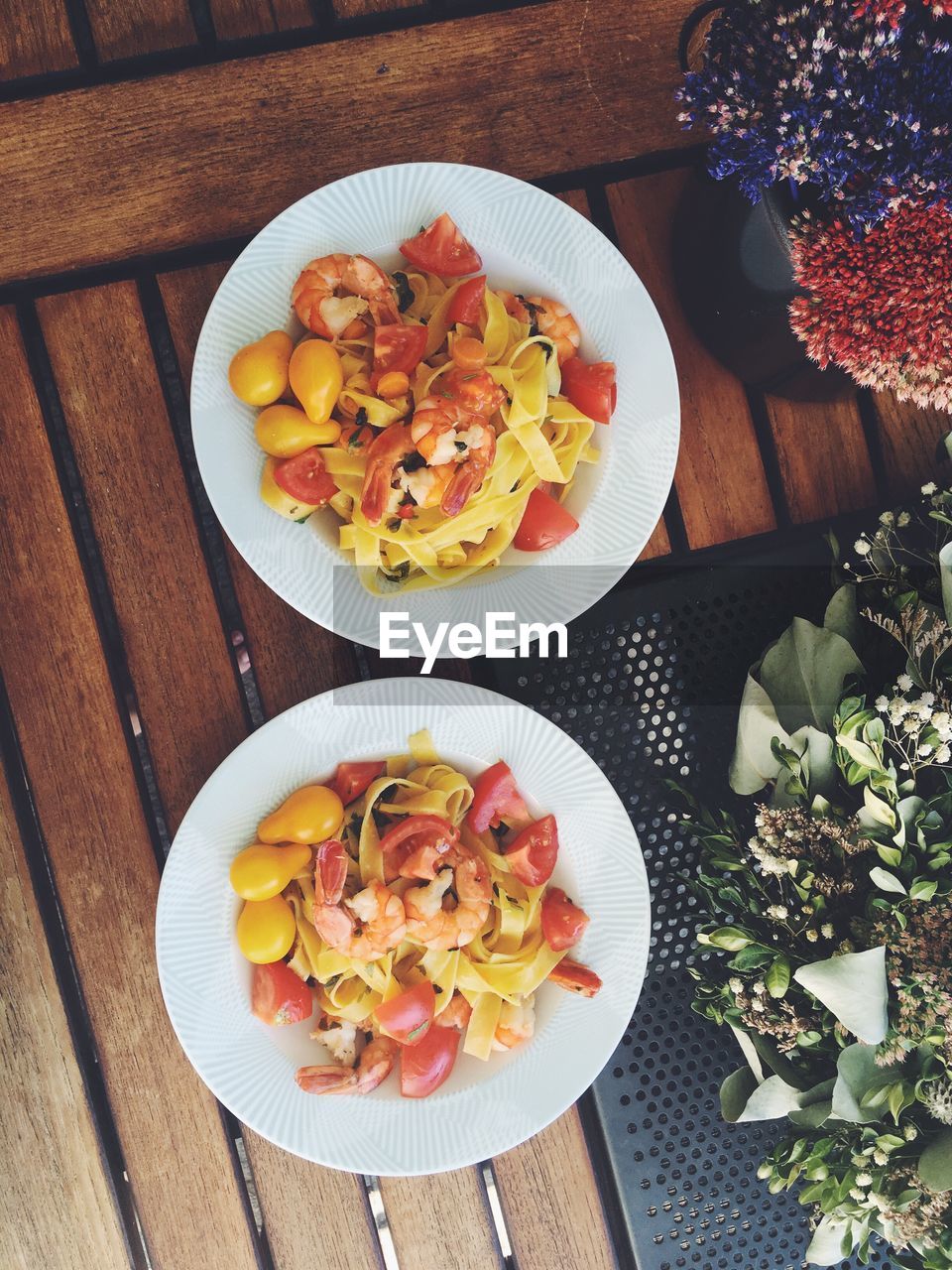 Directly above shot of pasta in plates on table