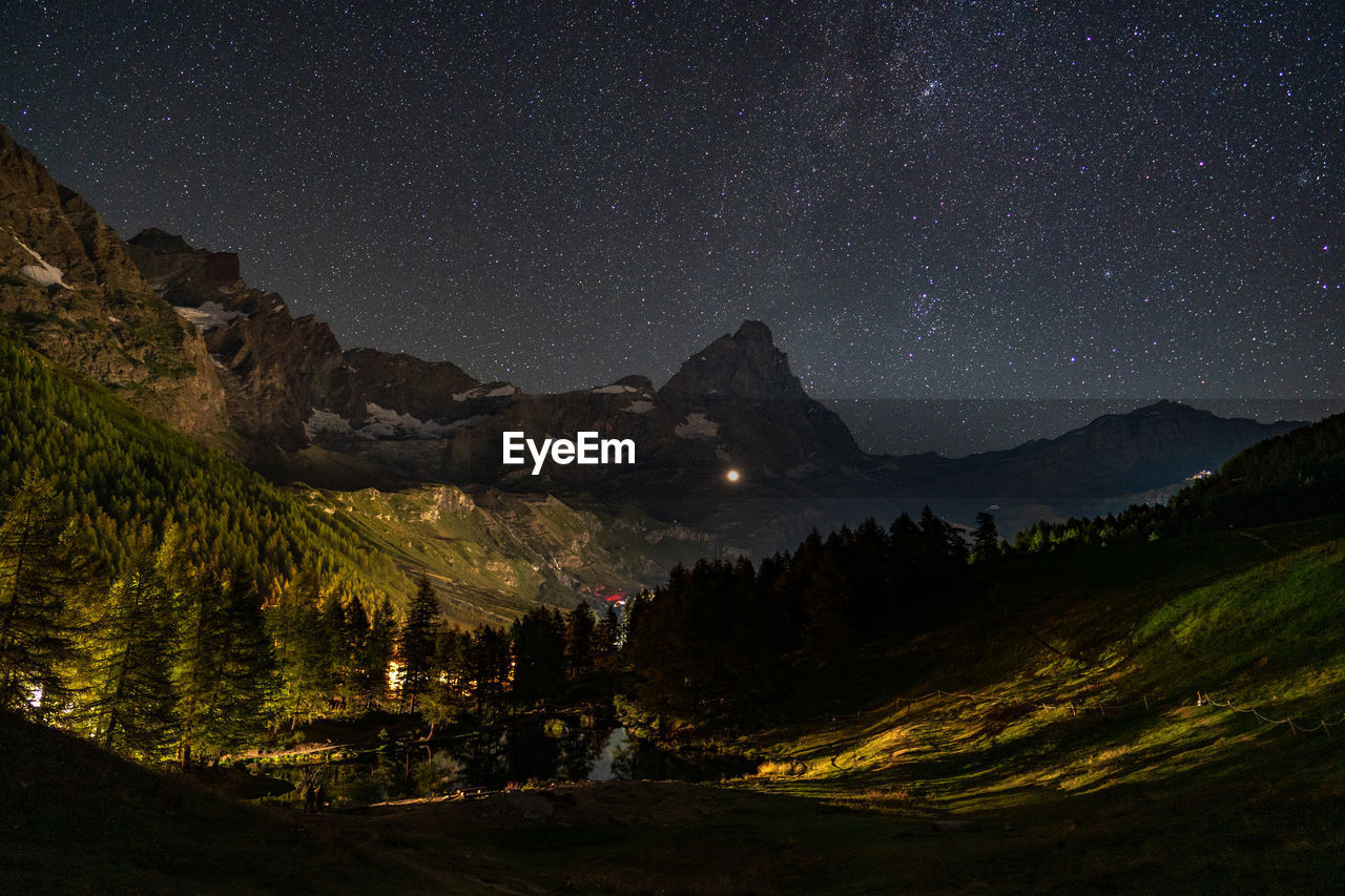 Scenic view of matterhorn against sky at night
