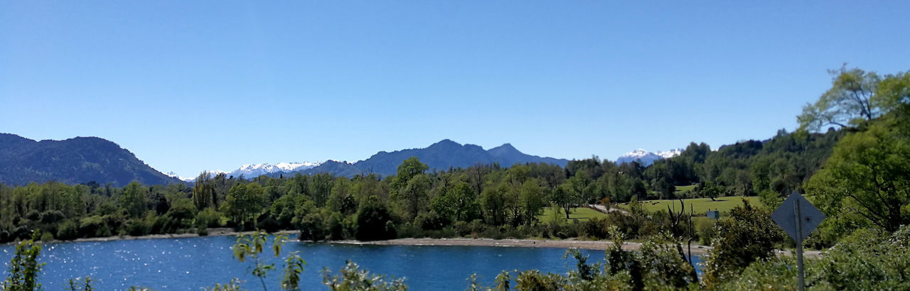 PANORAMIC VIEW OF LAKE AGAINST CLEAR BLUE SKY