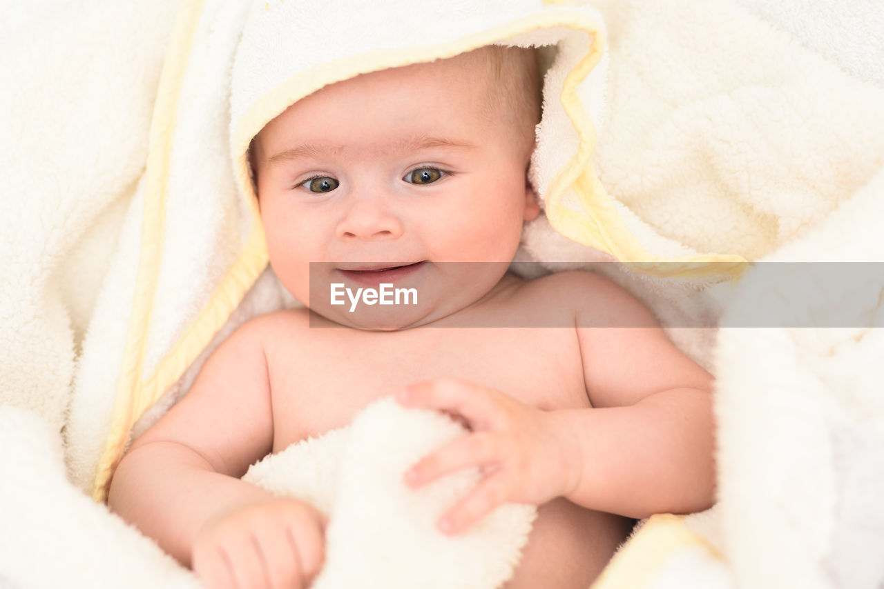 Cute baby girl in towel