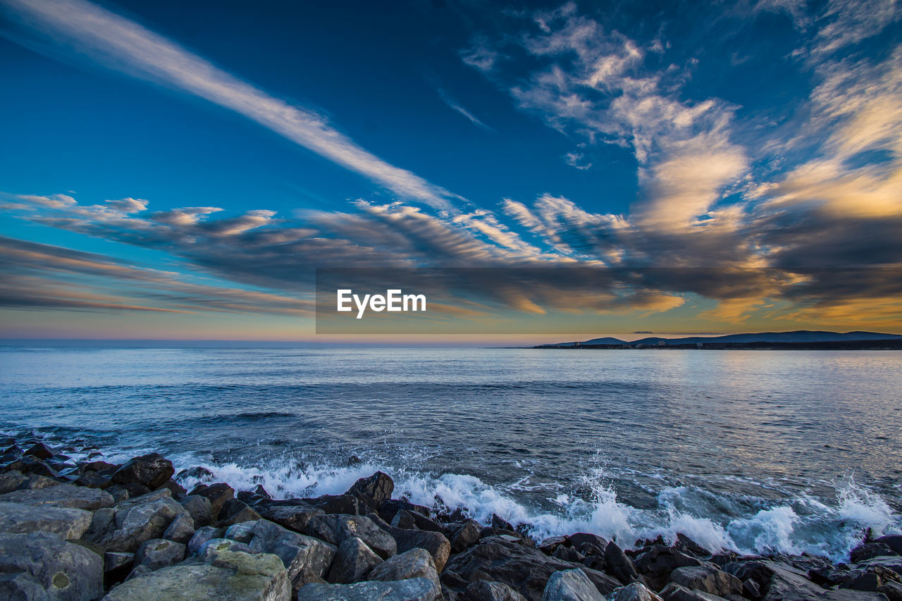 Scenic view of sea against sky during sunset