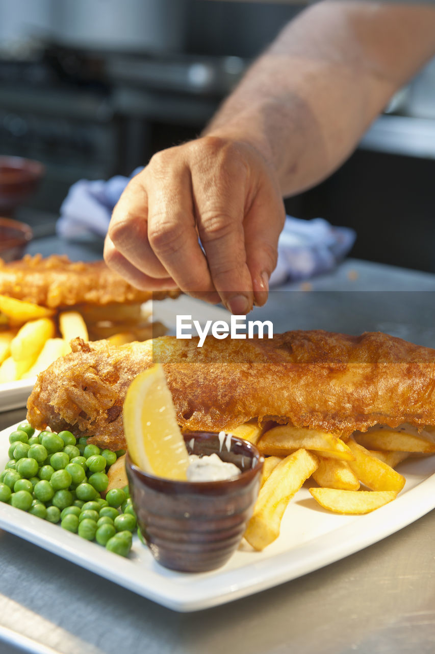 Fish and chips prepared at commercial kitchen in the uk