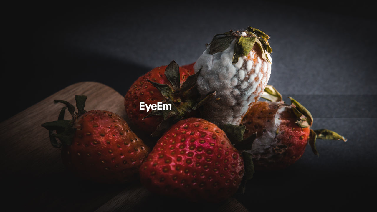 CLOSE-UP OF FRUITS ON TABLE