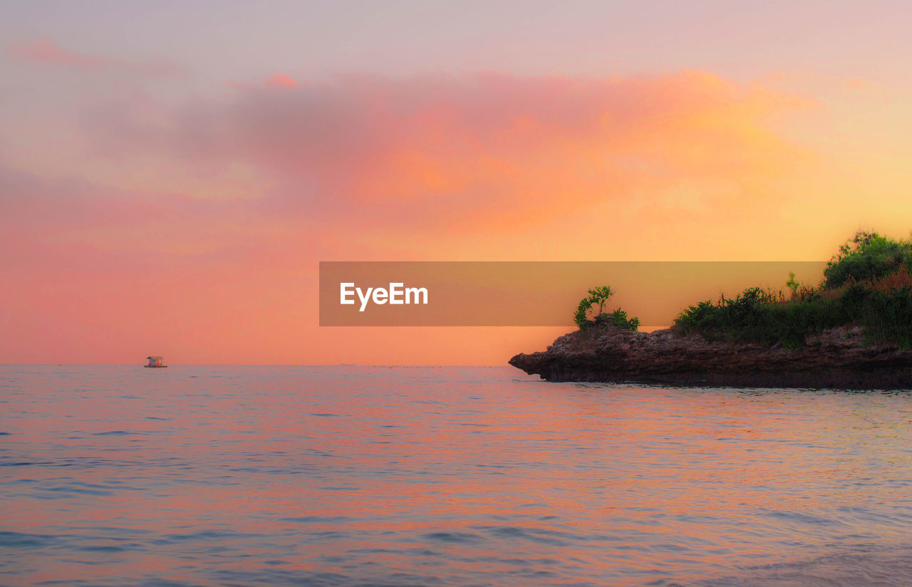 SCENIC VIEW OF SEA DURING SUNSET