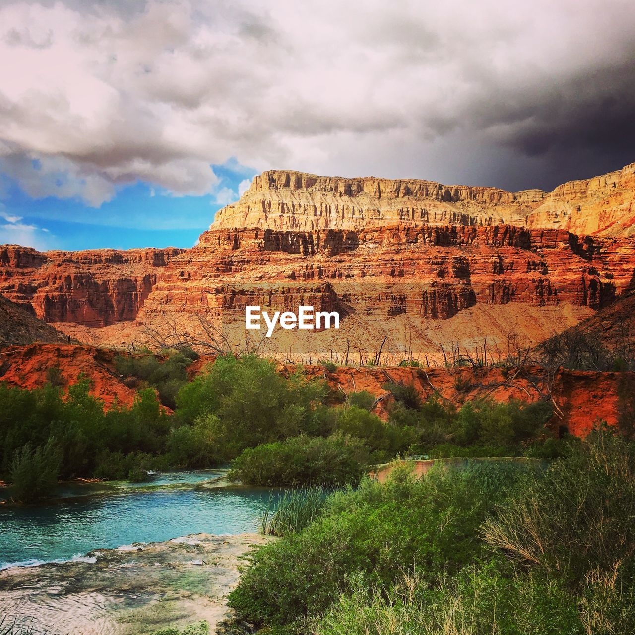 Scenic view of landscape against cloudy sky