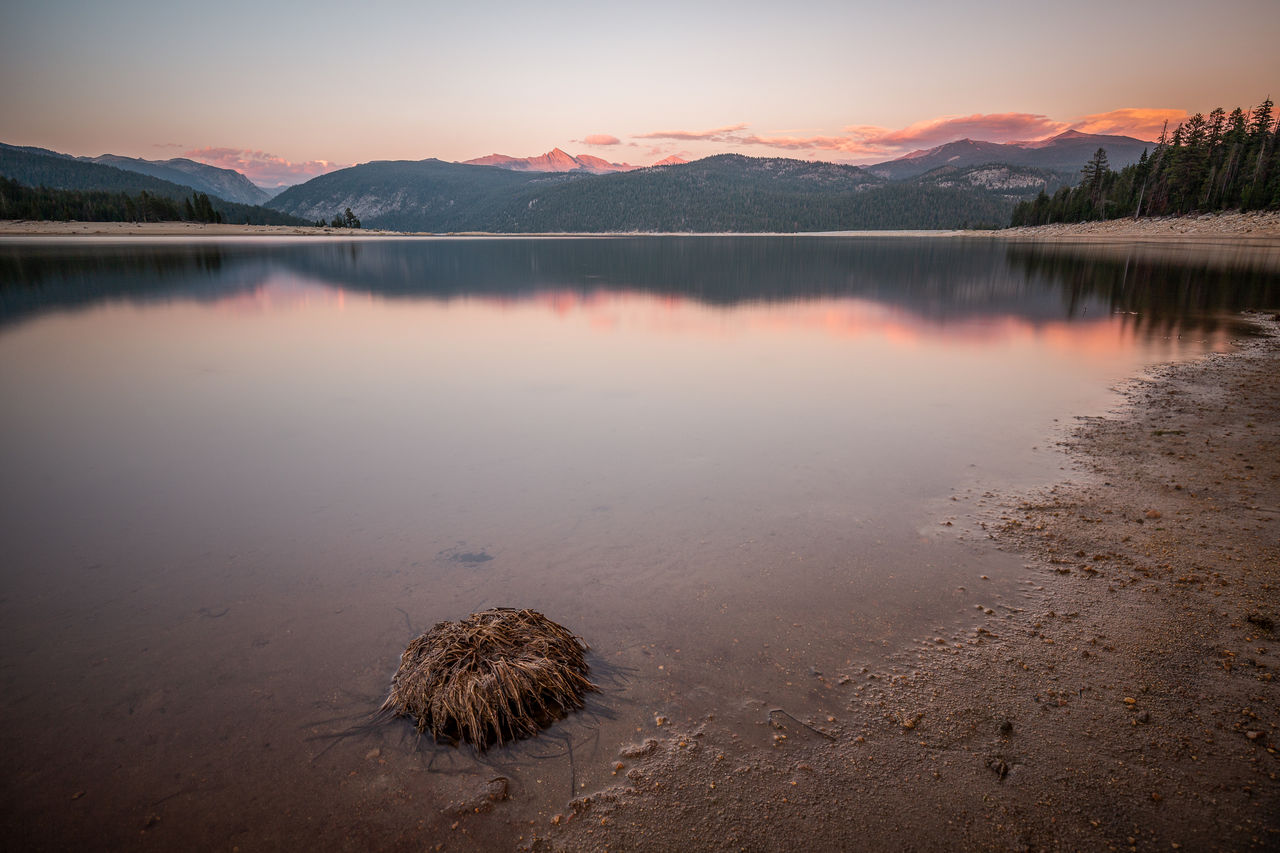 Scenic view of lake against sky during sunset