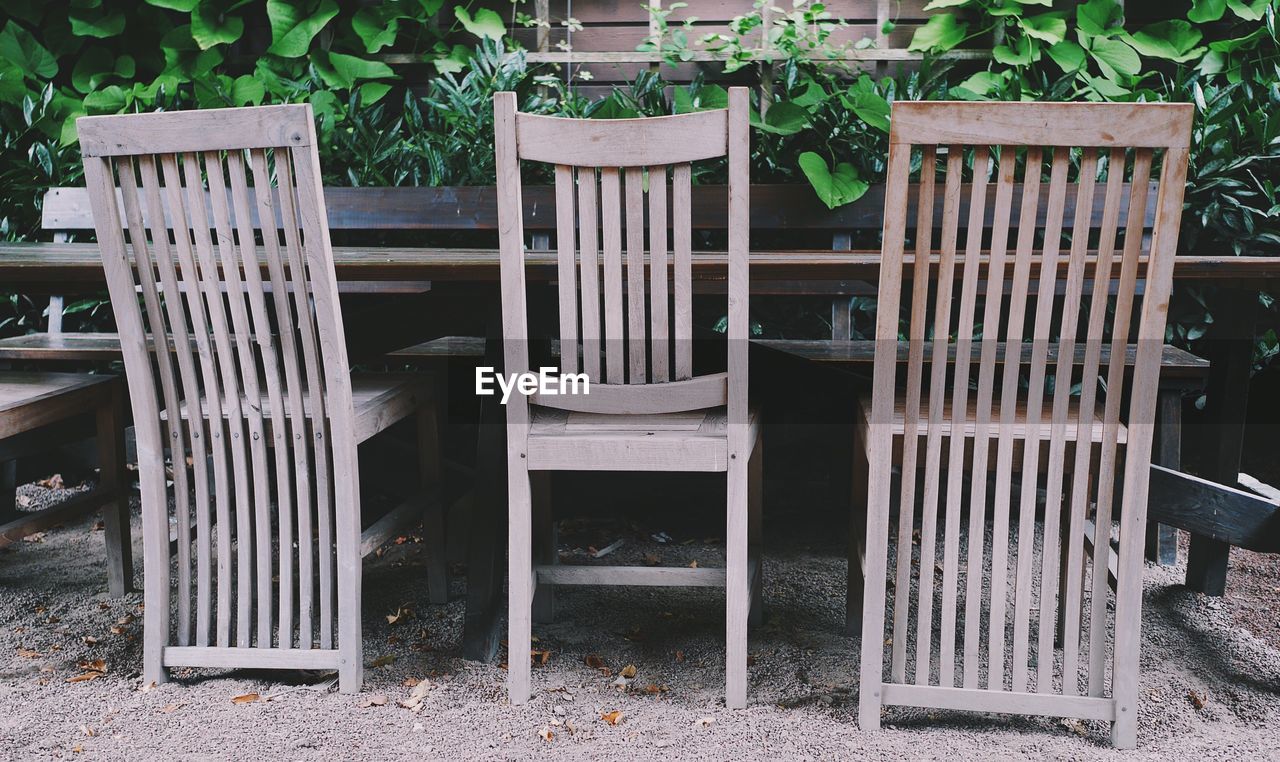 CHAIRS AND TABLES IN YARD