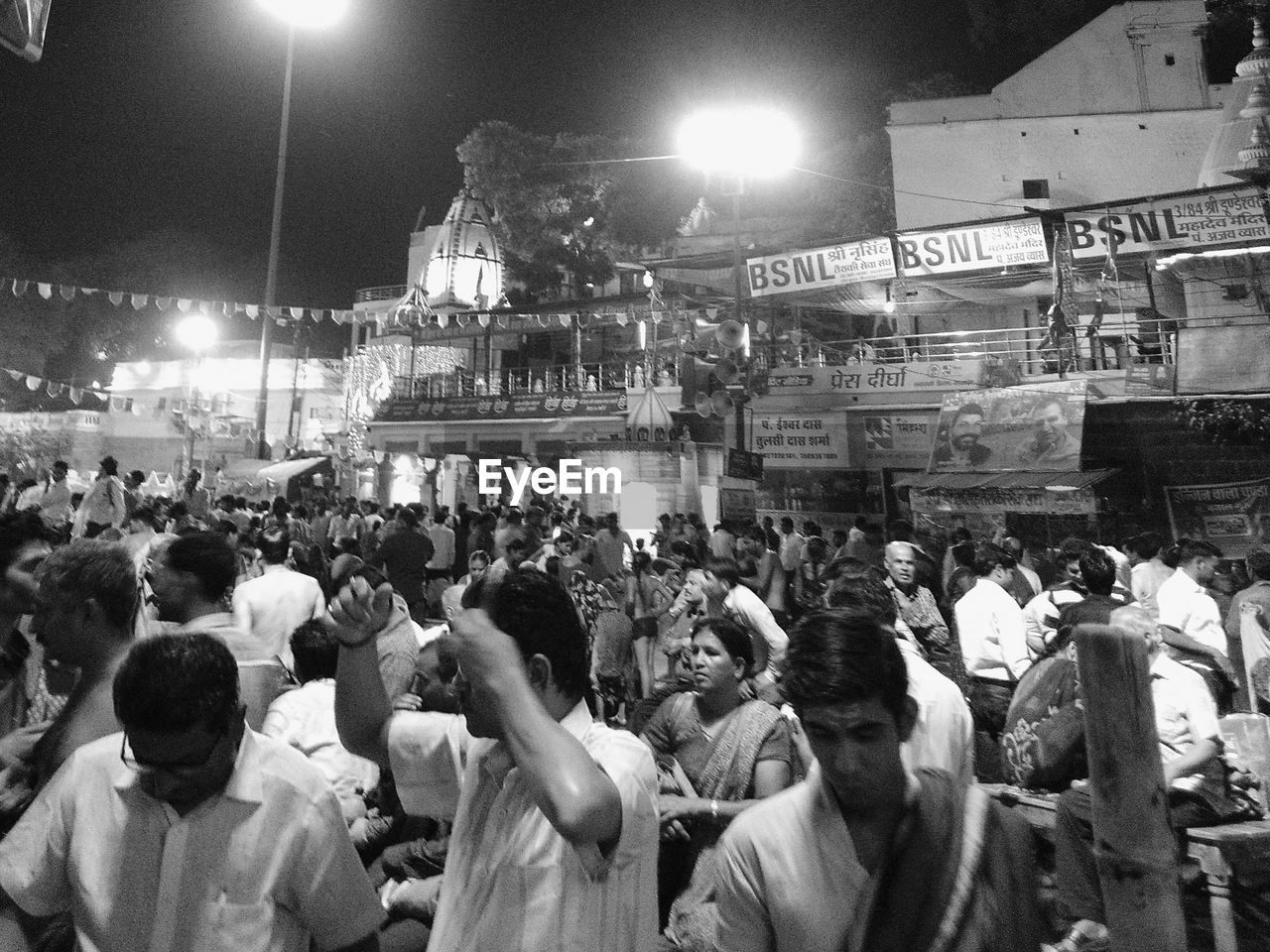 PEOPLE IN ILLUMINATED STADIUM