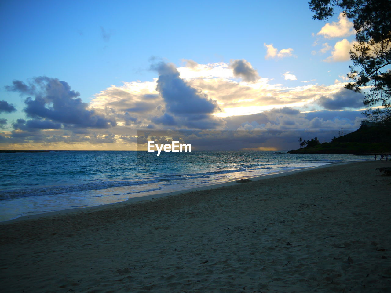 Scenic view of beach against sky during sunset