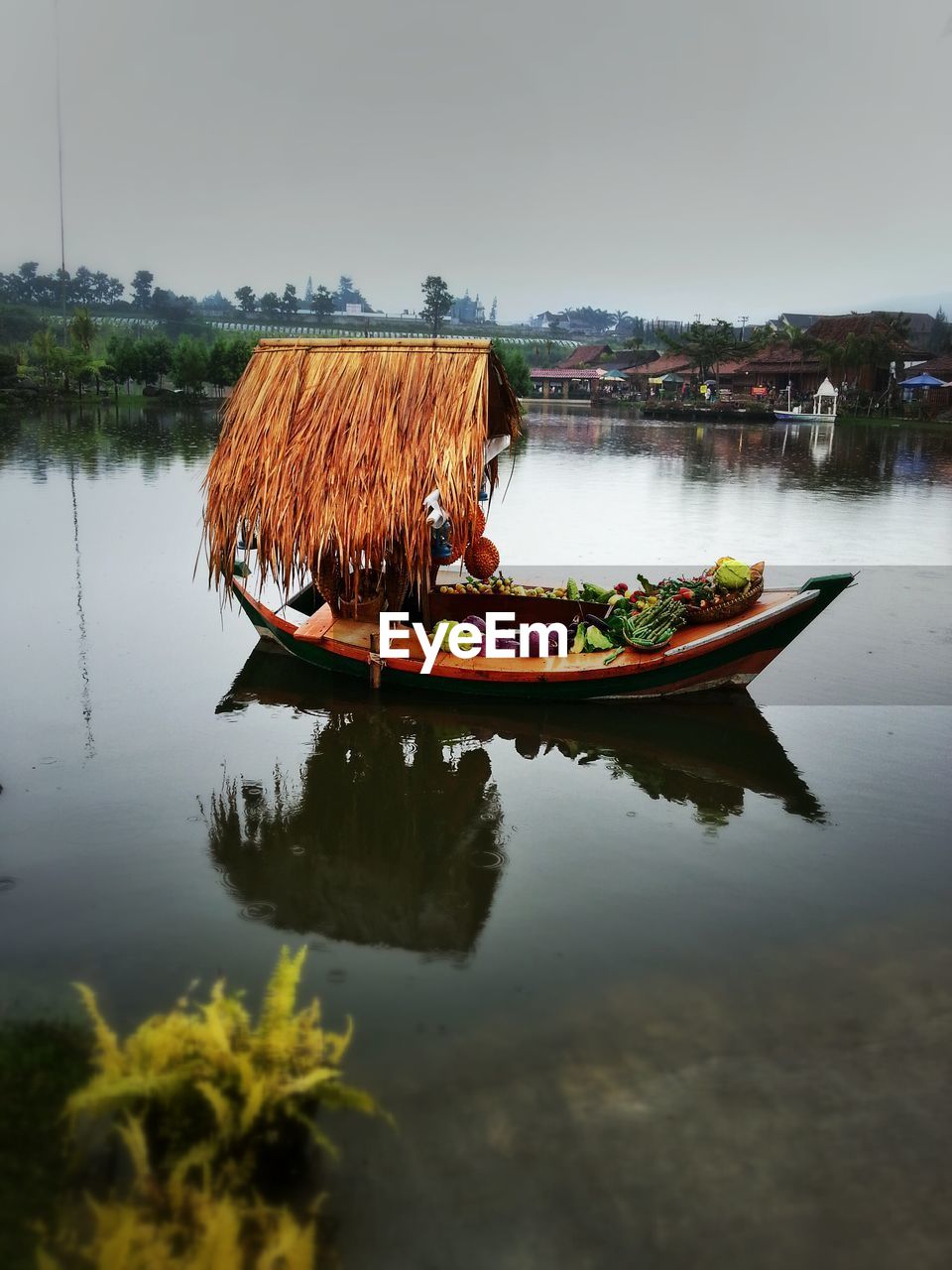 Floating market boat with vegetables in river