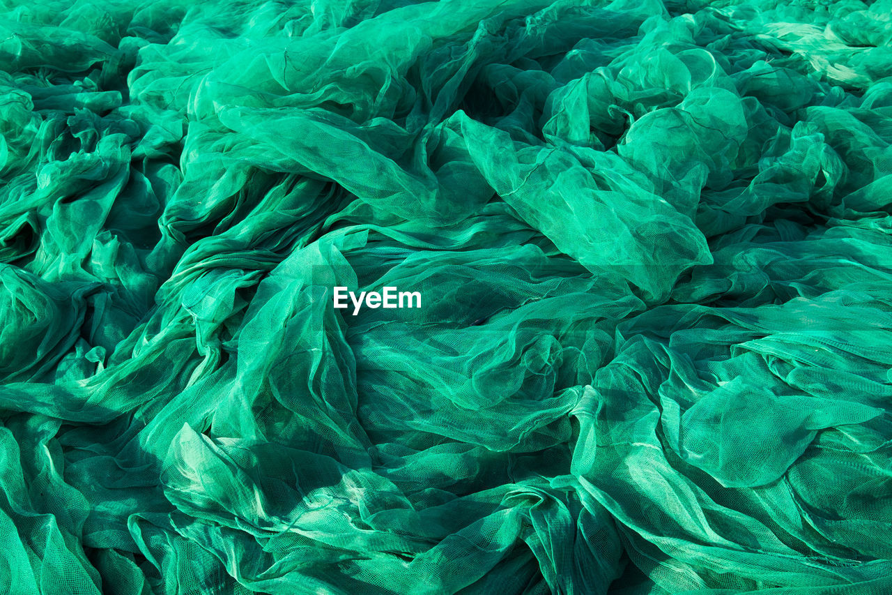 Full frame shot of crumpled green tulle netting