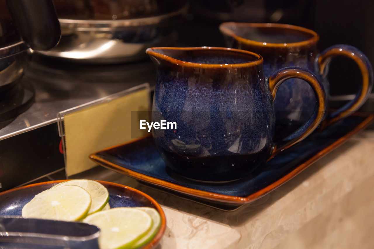 HIGH ANGLE VIEW OF FOOD ON TABLE AT KITCHEN