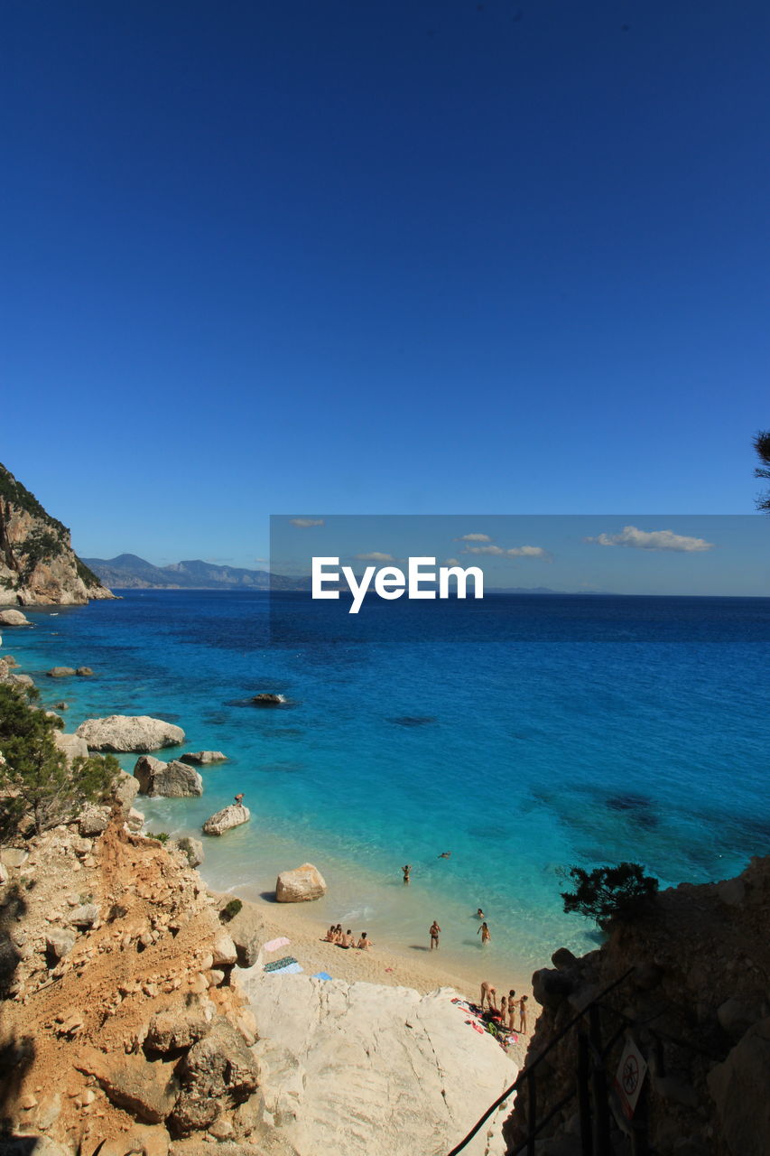 Scenic view of sea against clear blue sky