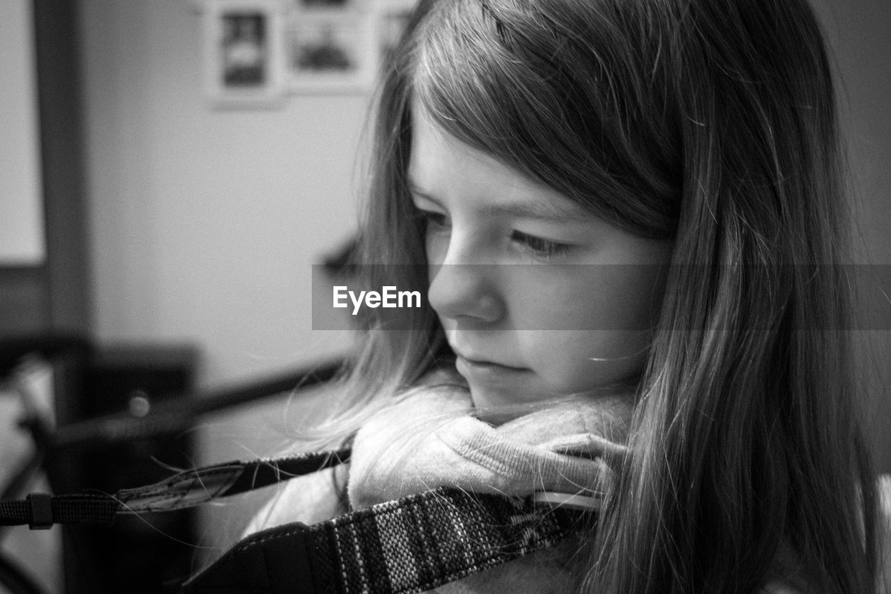 Close-up of thoughtful girl at home