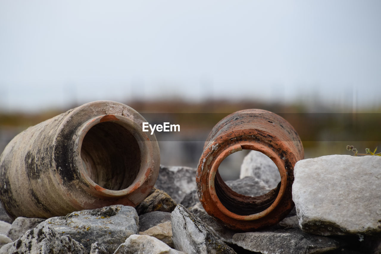 CLOSE-UP OF RUSTY PIPES