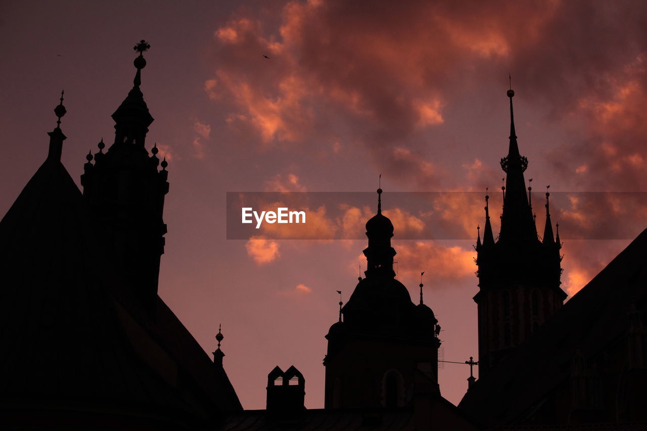 Low angle view of silhouette wawel cathedral against sky during sunset