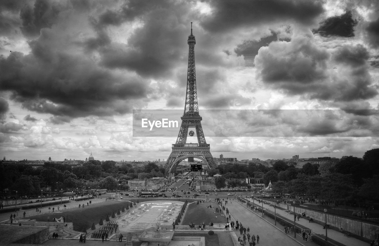 Eiffel tower against cloudy sky