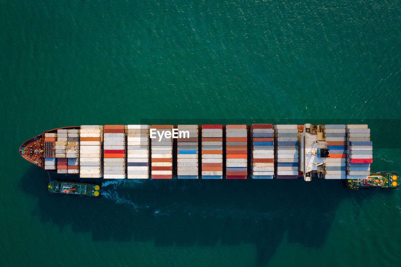 Aerial top view from drone, container ship or cargo shipping business logistic import and export 