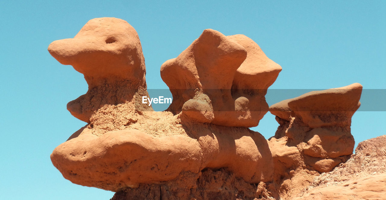 Rock formations against clear sky at goblin valley state park