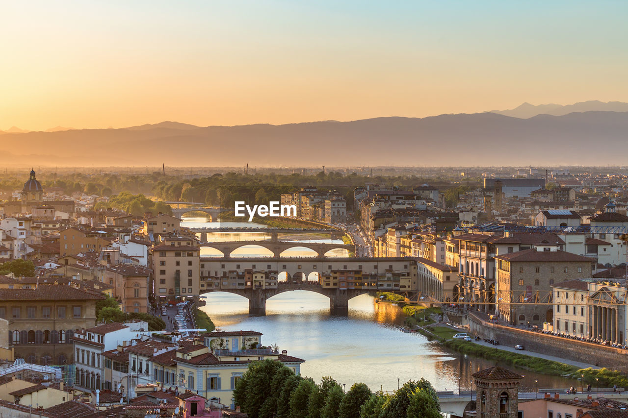 High angle view of bridge over river at sunset