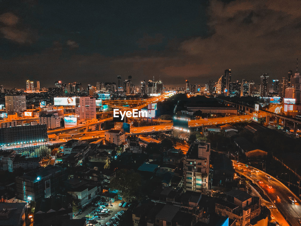 High angle view of illuminated buildings in city at night