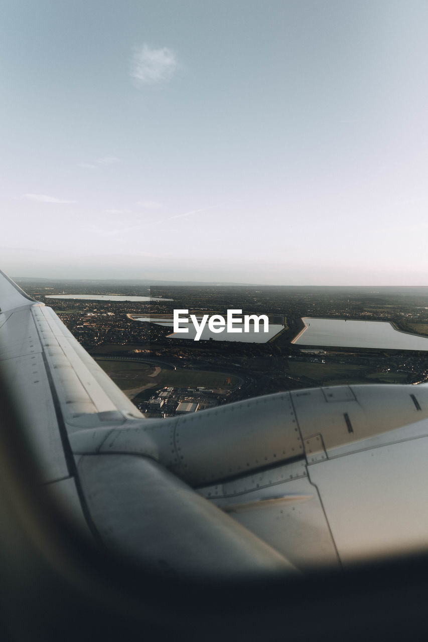 AERIAL VIEW OF AIRPLANE WING OVER SEA