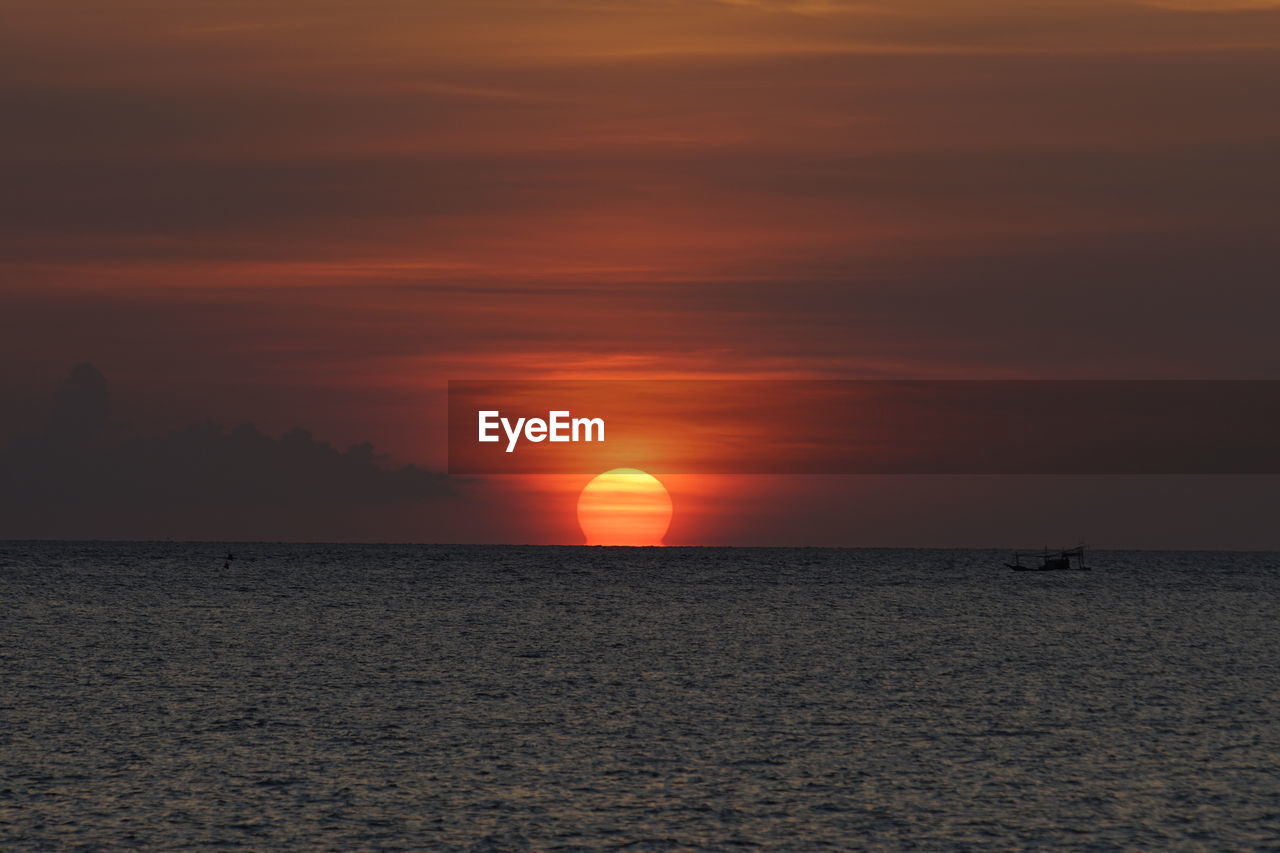 SCENIC VIEW OF SEA DURING SUNSET