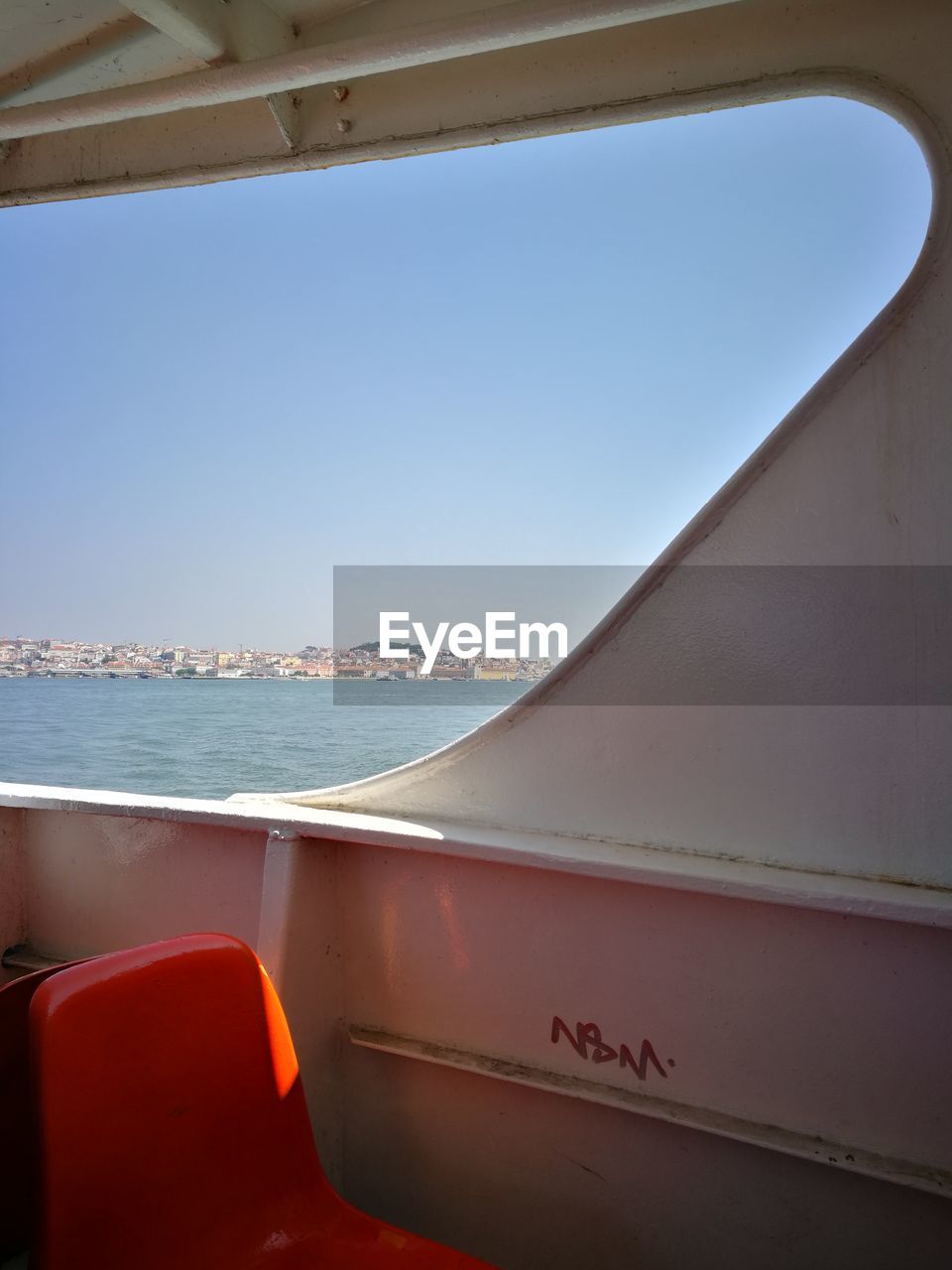 SCENIC VIEW OF SEA AGAINST CLEAR SKY SEEN THROUGH WINDOW